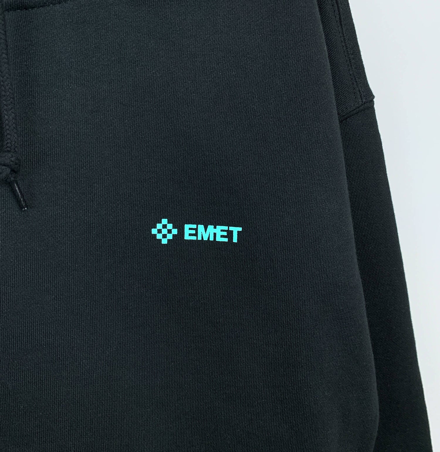 EMET Logo Hoodie in Black - Front Close Up